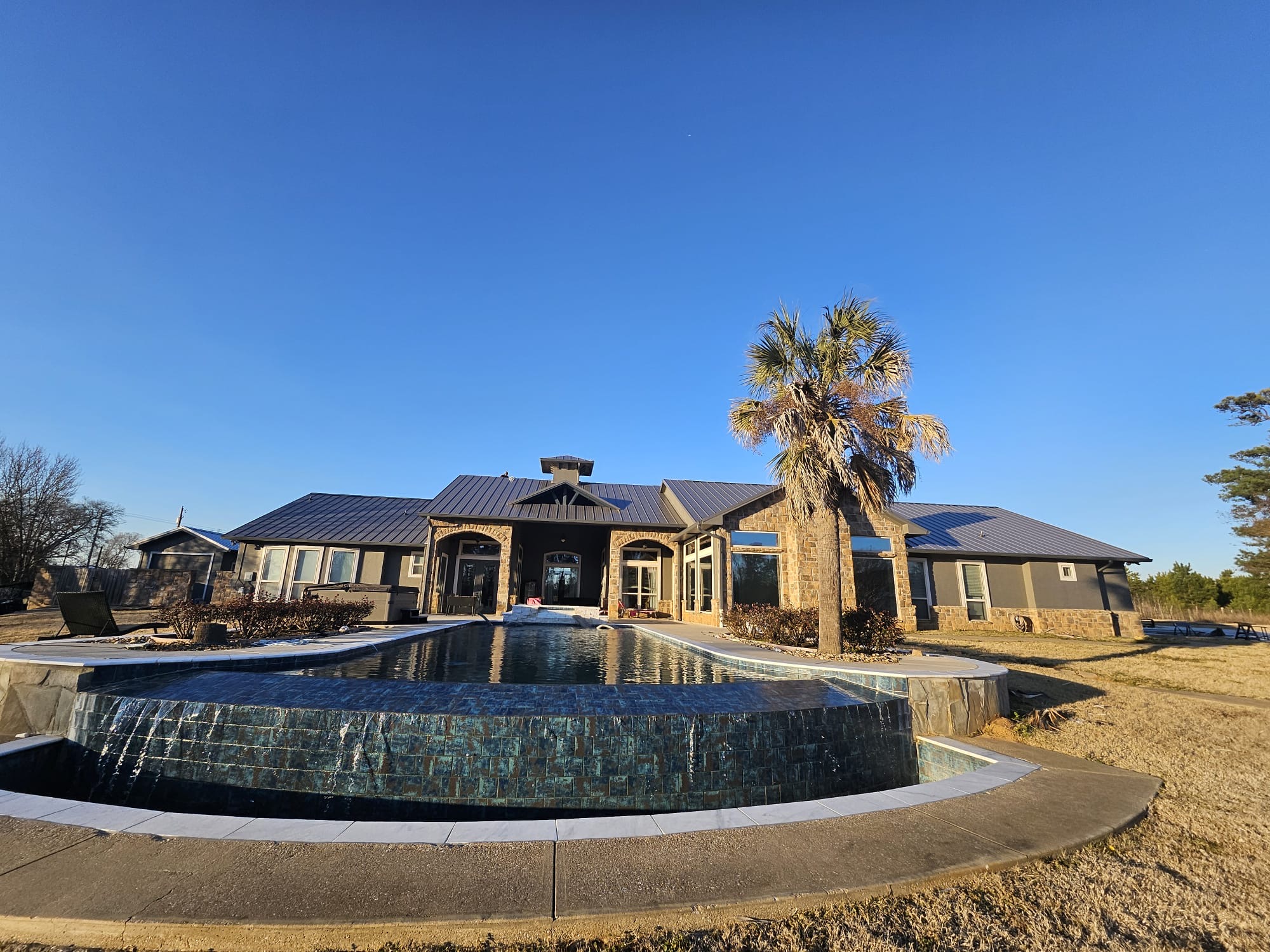 Premium Metal Roof Installation on Lakeside Luxury Home