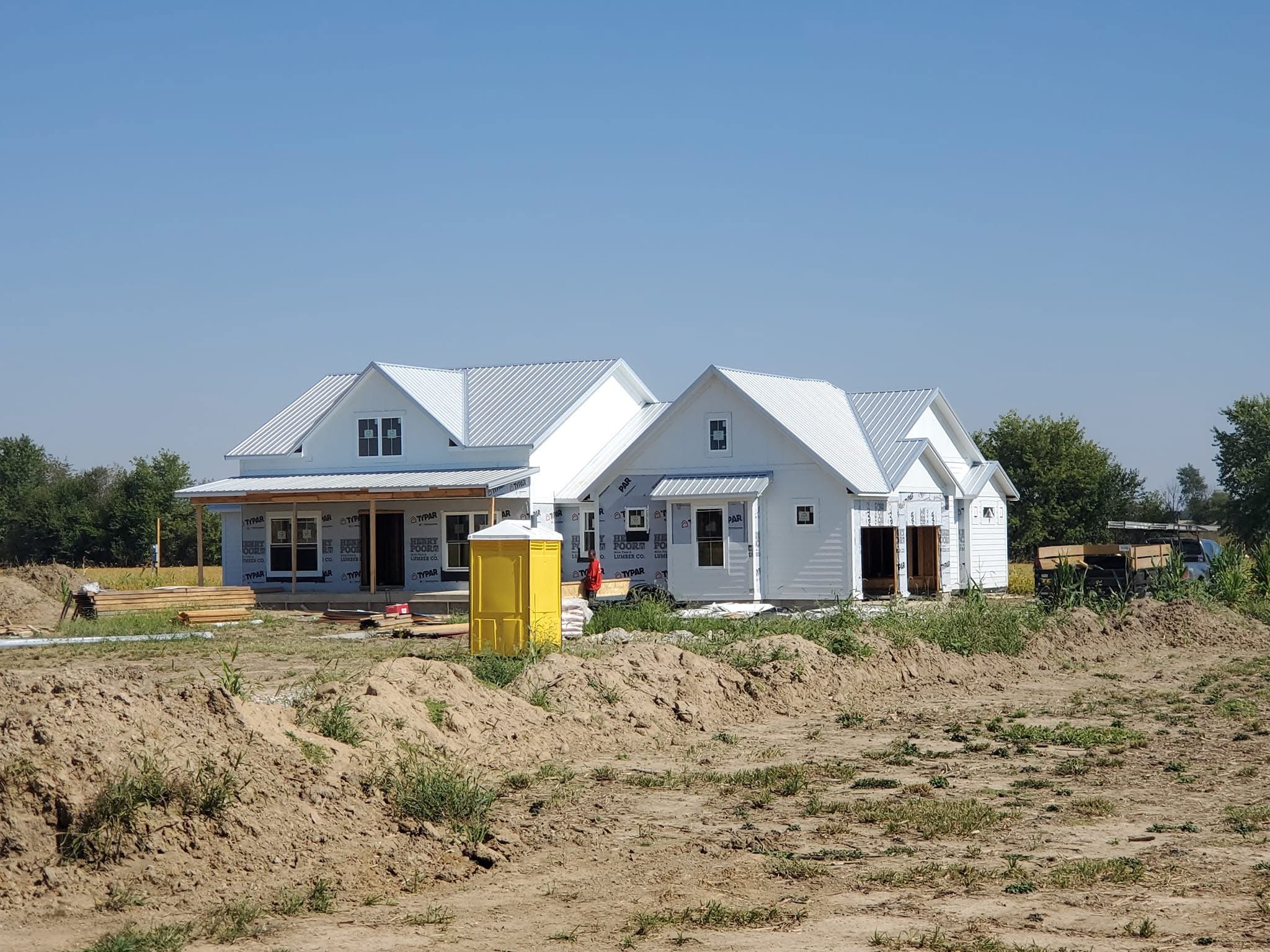White Standing Seam Metal Roofs for New Farmhouse Construction